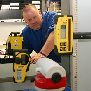 Steve Hoyle calibrating a rotating laser in the YSSC Repair Centre